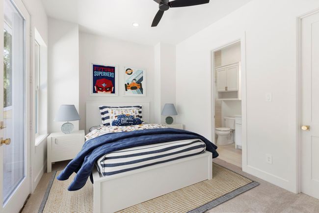 Secondary bedroom upstairs, also with its own closet, ensuite bath, and private balcony. | Image 28