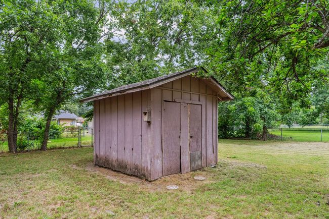 View of shed featuring a fenced backyard | Image 24