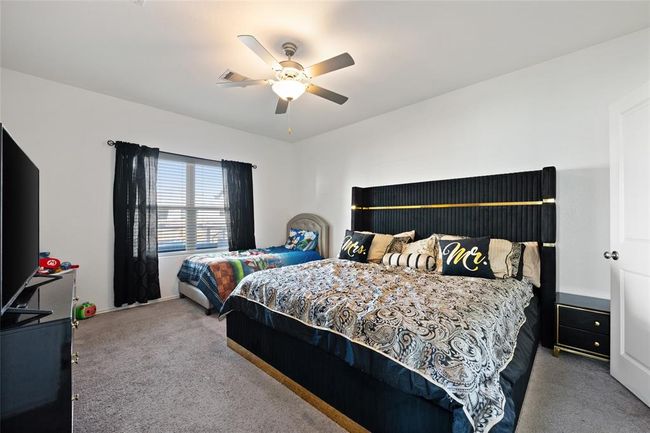 Carpeted bedroom with ceiling fan | Image 14