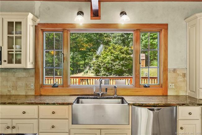 Kitchen overlooking backyard and deck | Image 8