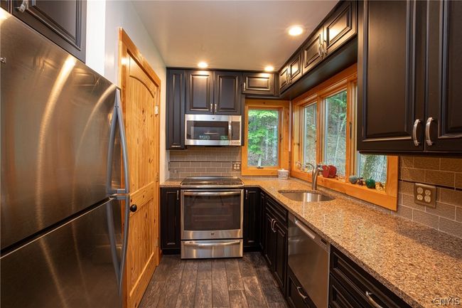 Kitchen includes walk-in pantry for extra storage | Image 44