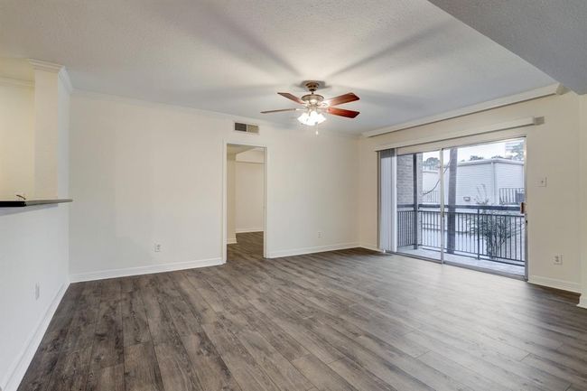 View of the dining room facing the second bedroom. | Image 9
