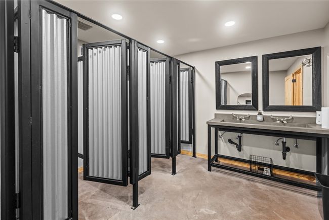 Bathroom with finished concrete floors and recessed lighting | Image 26
