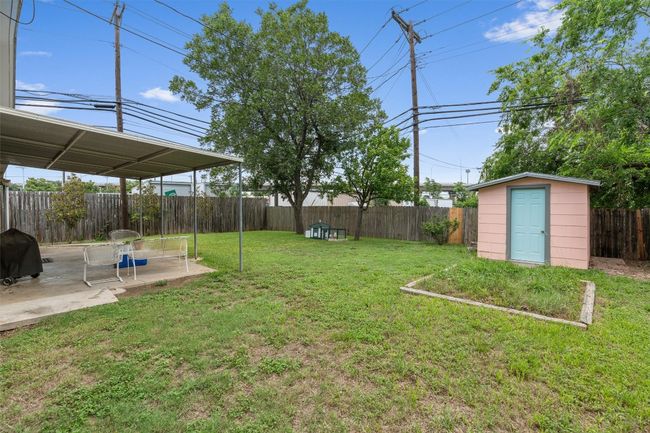 Private backyard featuring a patio area and a shed | Image 30