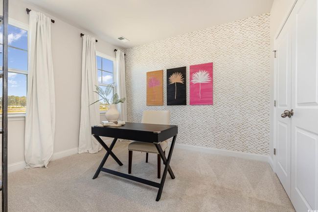 Carpeted office with wallpapered walls and baseboards | Image 31