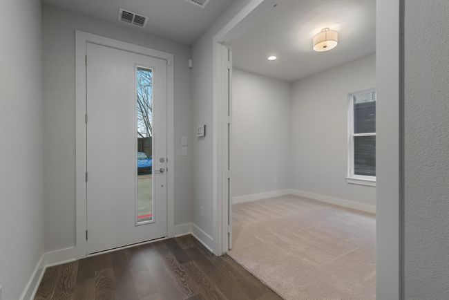 Foyer featuring baseboards, wood finished floors, visible vents, and recessed lighting | Image 6
