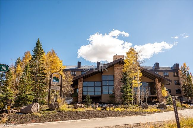 View of front facade featuring a chimney and stucco siding | Image 32
