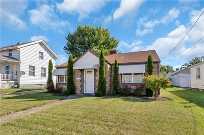 View of front facade with a front yard | Image 3