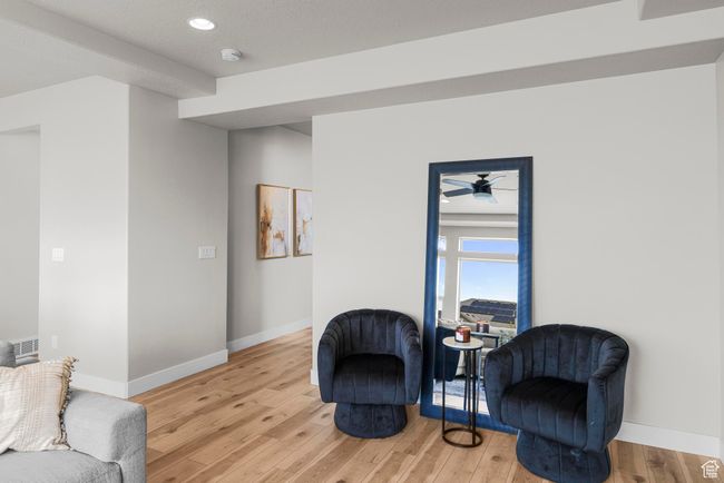 Sitting room with recessed lighting, visible vents, light wood-style floors, and baseboards | Image 8