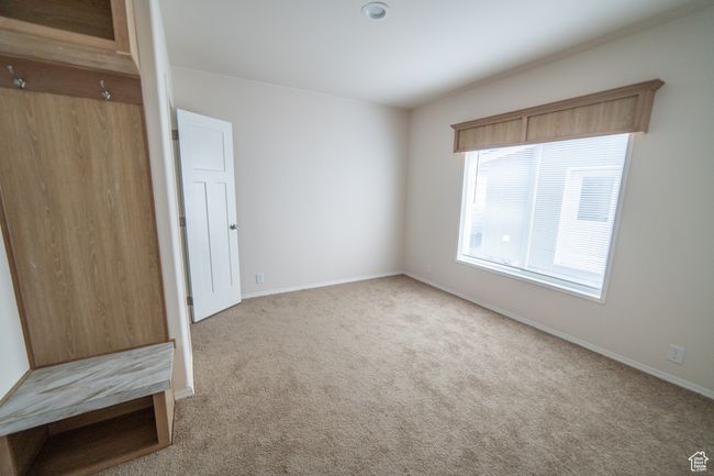 Unfurnished bedroom featuring carpet floors and baseboards | Image 66