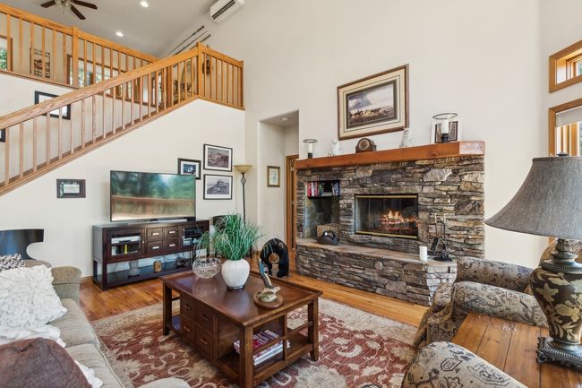 Living Area w/Fireplace | Image 17