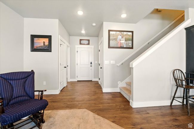 Foyer entrance featuring stairway, wood finished floors, and recessed lighting | Image 7
