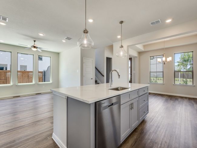 With a view to the dining and family rooms, the chef will never be left out of the party in this dream home! | Image 7