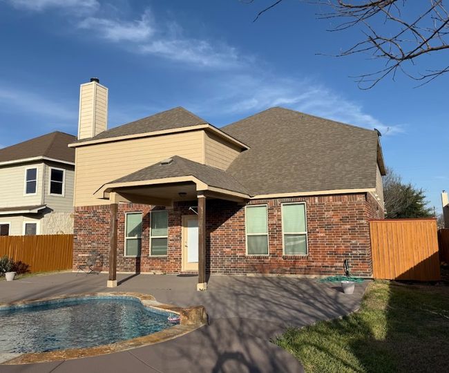 Side view of swimming pool, with great backyard to enjoy an entertain family & friends. | Image 31