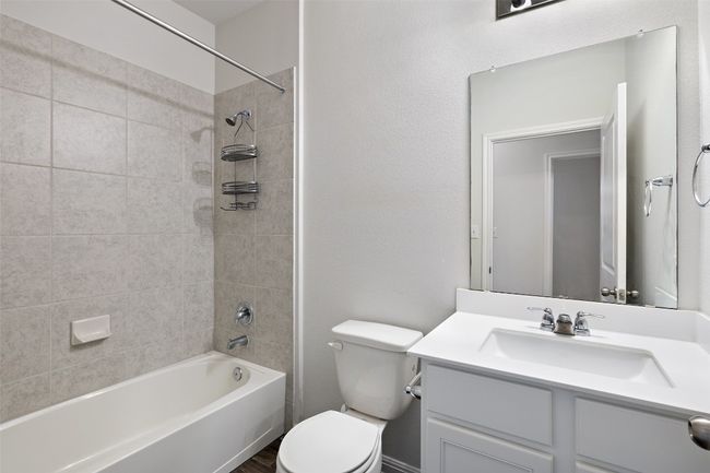 Bathroom with shower / bathing tub combination, toilet, and vanity | Image 19