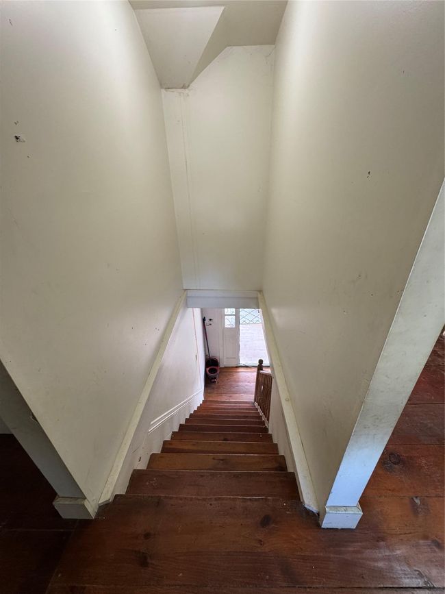 Staircase featuring hardwood / wood-style flooring | Image 28