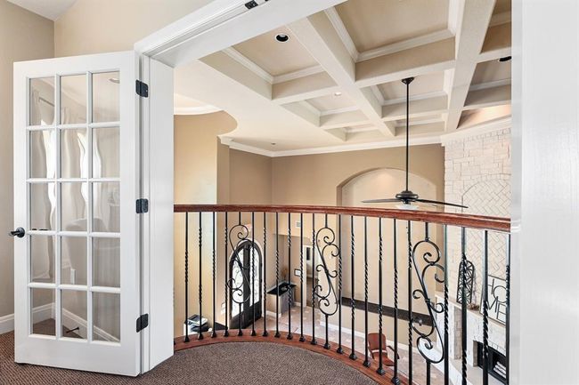 Corridor featuring coffered ceiling, beamed ceiling, and crown molding | Image 19