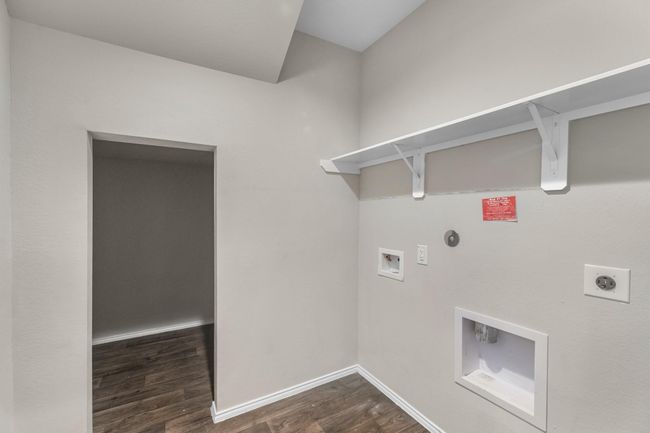 Large laundry room on first floor with an ample storage area, that is a must see to believe! | Image 13