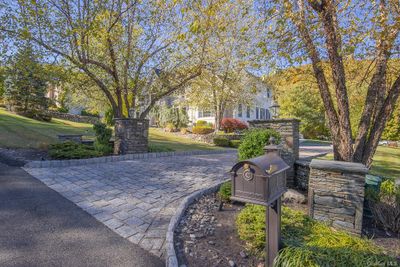 View of community featuring a yard | Image 2