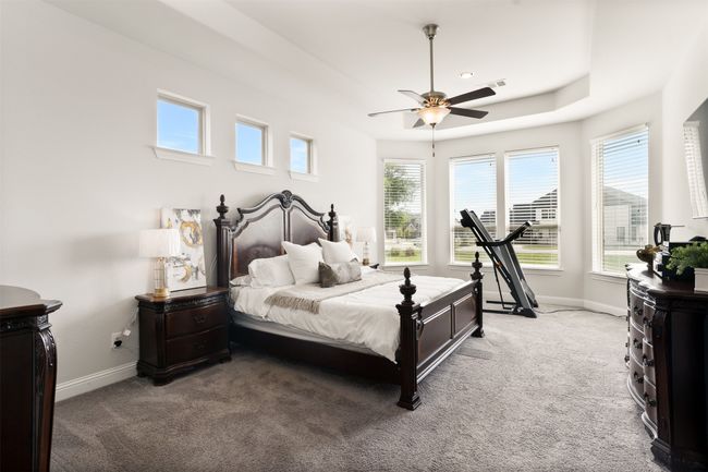 Bedroom featuring visible vents, carpet flooring, baseboards, and ceiling fan | Image 20