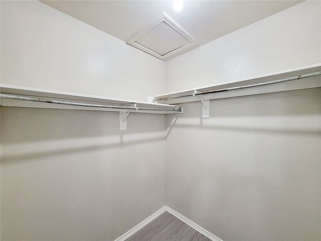 Walk in closet featuring hardwood / wood-style floors | Image 16