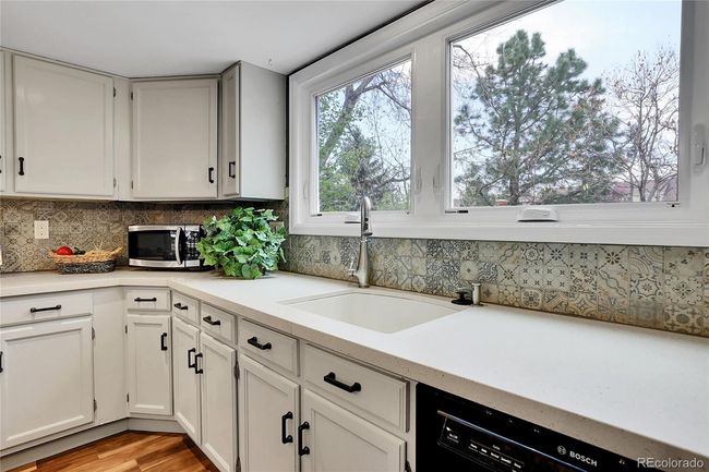 CORIAN COUNTER & CUSTOM TILE BACKSPLASH | Image 11