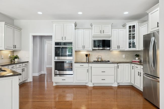 Gourmet kitchen complete with stainless steel appliances, gas cooking and ample cabinet space. | Image 8