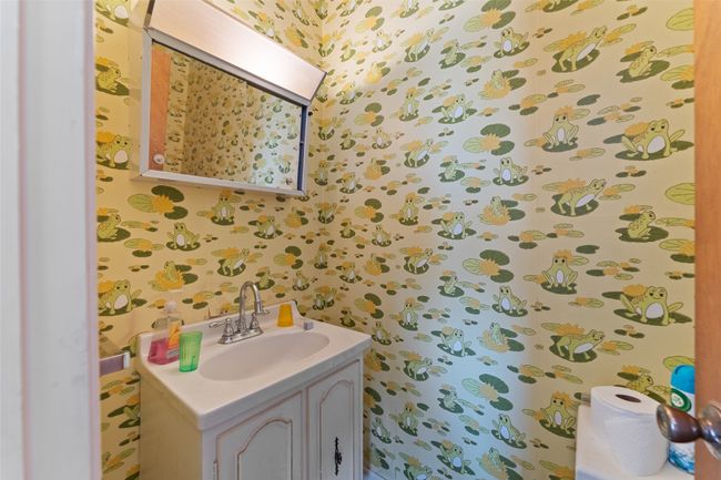 Bathroom featuring vanity and wallpapered walls | Image 13