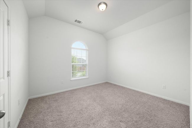 Secondary bedroom featuring lofted ceiling and baseboards | Image 28