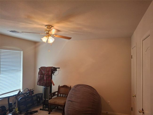 Sitting room featuring ceiling fan and visible vents | Image 17