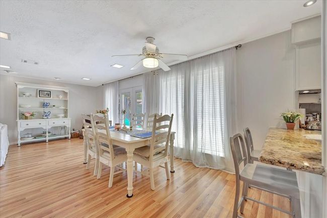There is a formal dining room within the home but there is also an open dining or breakfast space that will accommodate a large table. If you love having friends or family over, this house is a must see because of the layout, you can use the space in a variety of ways that work best for you. | Image 14