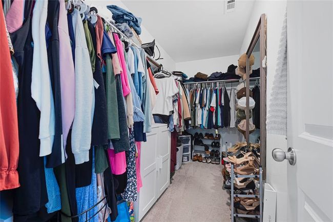 Generous walk-in closet with plenty of space for storage and organization. | Image 23