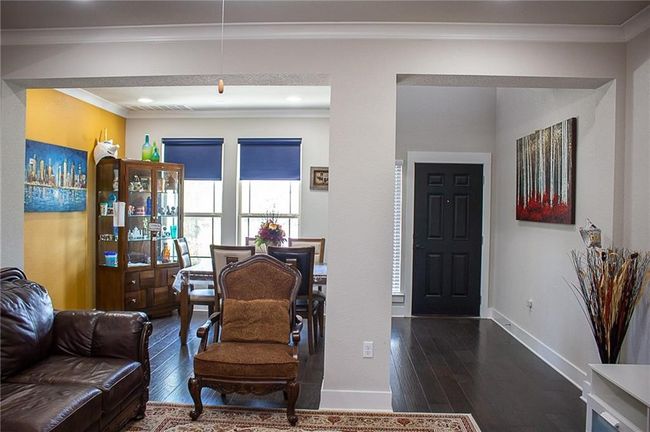 Walls are of neutral same color as rest of the house. | Image 7