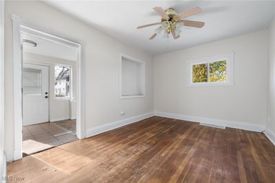 First Floor unit living room with a wealth of natural light | Image 3