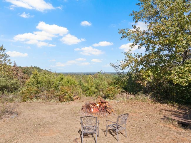 View of yard with an outdoor fire pit | Image 21