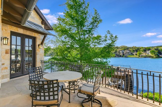 Balcony with a water view and french doors | Image 37