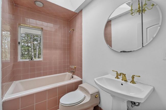 Full bathroom with bath tub and skylight. | Image 14