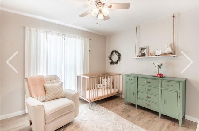 Bedroom with light wood-type flooring, a nursery area, and ceiling fan | Image 23