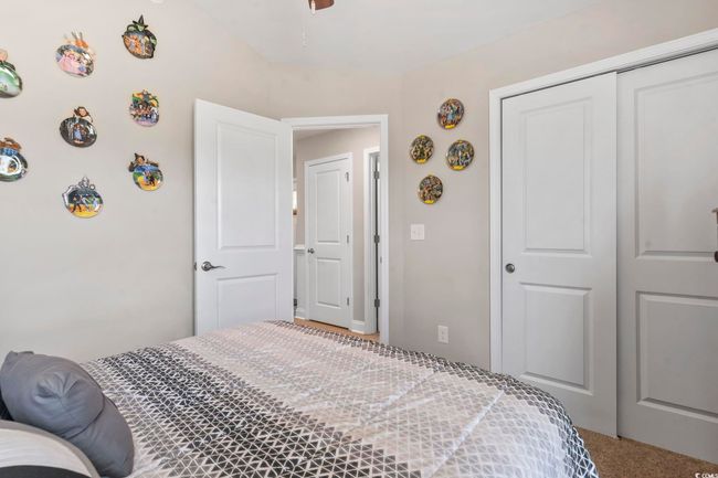 Bedroom featuring a closet, carpet floors, and ceiling fan | Image 20
