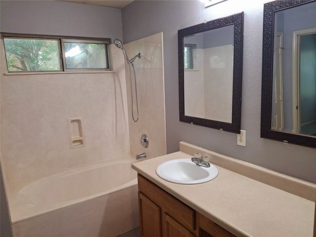 Bathroom with vanity and shower / marble garden tub combination | Image 11