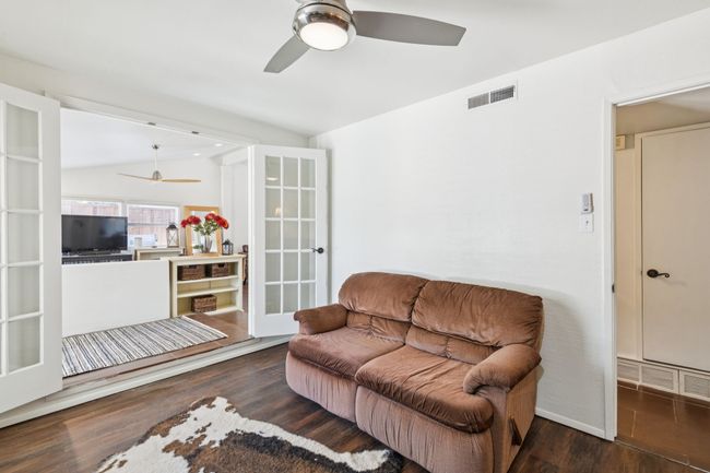 Den or Office off Living area featuring ceiling fan and french doors | Image 16