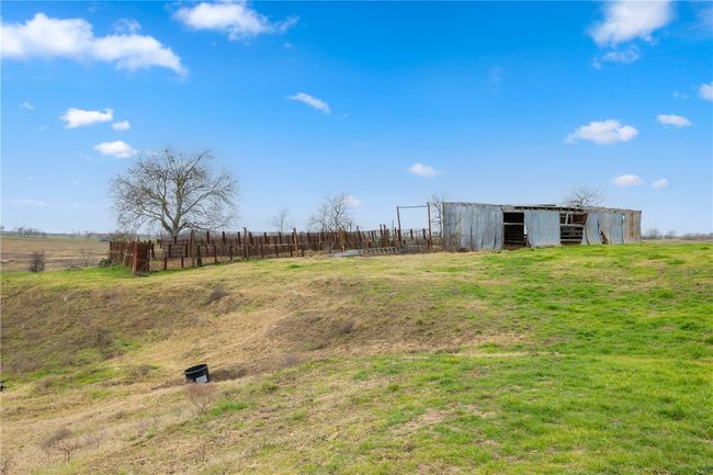 View of yard with an outdoor structure and a rural view | Image 24