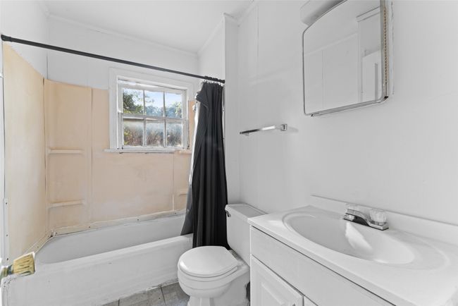 Bathroom with vanity, crown molding, and shower / bath combo with shower curtain | Image 10