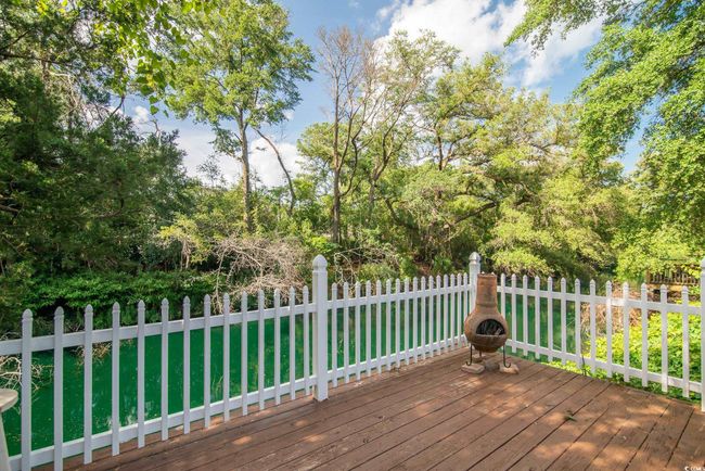 Wooden terrace with view of scattered trees | Image 32