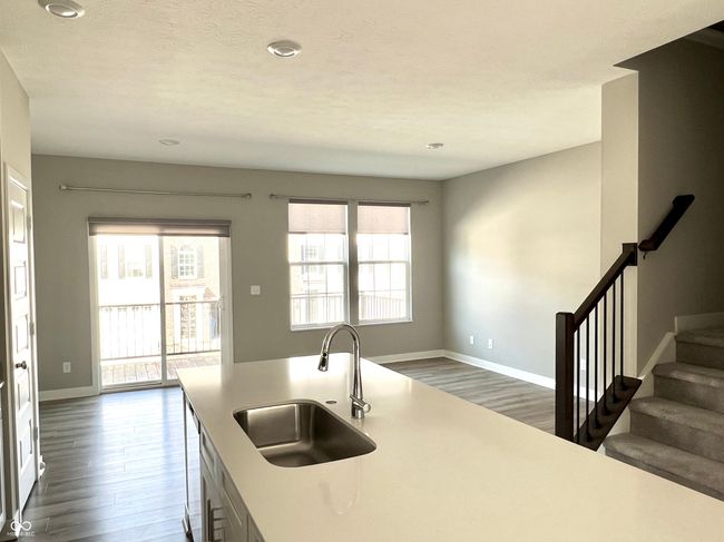 Kitchen opens to hearth room and sliders onto the rear deck | Image 24