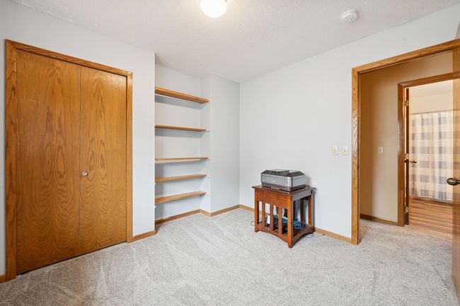 The featured shelving in this bedroom is included in the sale. | Image 15