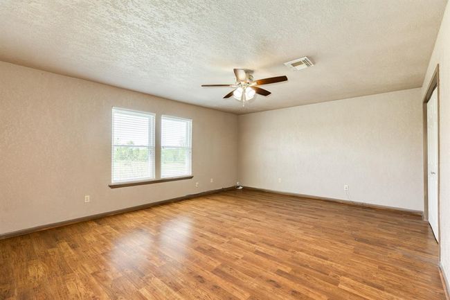 Current View of Primary Bedroom. There is a nice sized closet to the right of this photo. Also, there is an enormous walk-in closet in the bathroom upstairs which is approximately 11'5" x 6'4". Buyer to verify room measurements. | Image 36