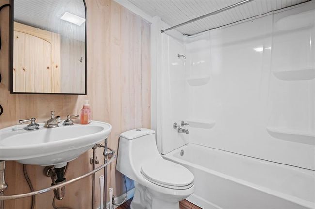 Full bathroom featuring tub / shower combination and toilet | Image 17