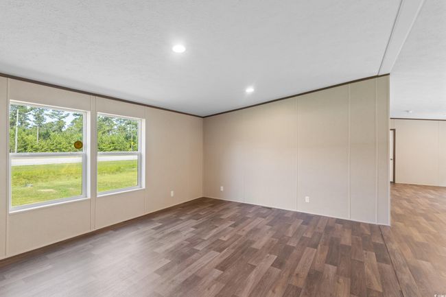Spare room featuring wood finished floors and recessed lighting | Image 39