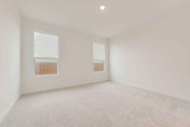 Spare room featuring light carpet and baseboards | Image 19